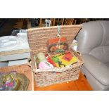 A wicker basket and contents of various tins, vint