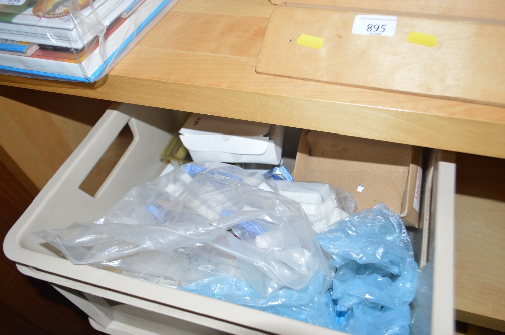 A box of various hair grips and pins