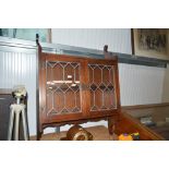 An oak leaded glazed cabinet