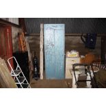 A large blue painted metal cabinet