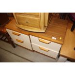 A pair of bedside chests fitted two drawers
