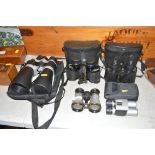 Five pairs of various binoculars