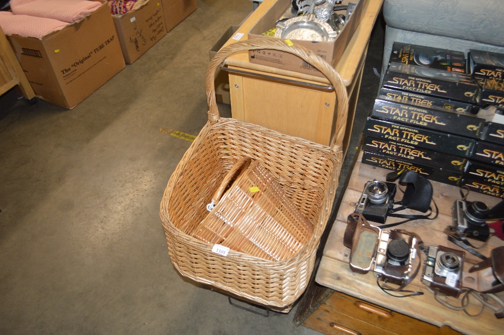 A wicker shopping basket together with a swing han