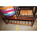 A teak and tile topped table