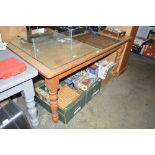 A stripped pine kitchen table