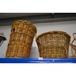 A wicker laundry basket; and a wicker log basket