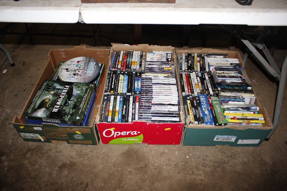 A box of DVDs and two boxes of video games