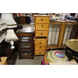 A pair of modern pine bedside chests fitted three