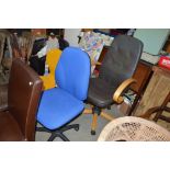 A blue upholstered swivel office chair; and one ot