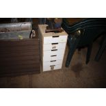 A small multi drawer wooden chest