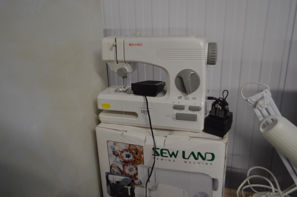 A Sew Land electric sewing machine in original box