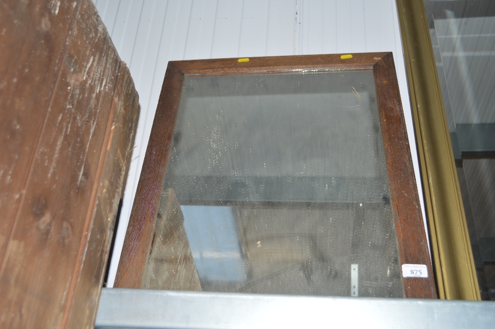 An oak framed oblong mirror