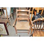 A pine rocking chair with string seat
