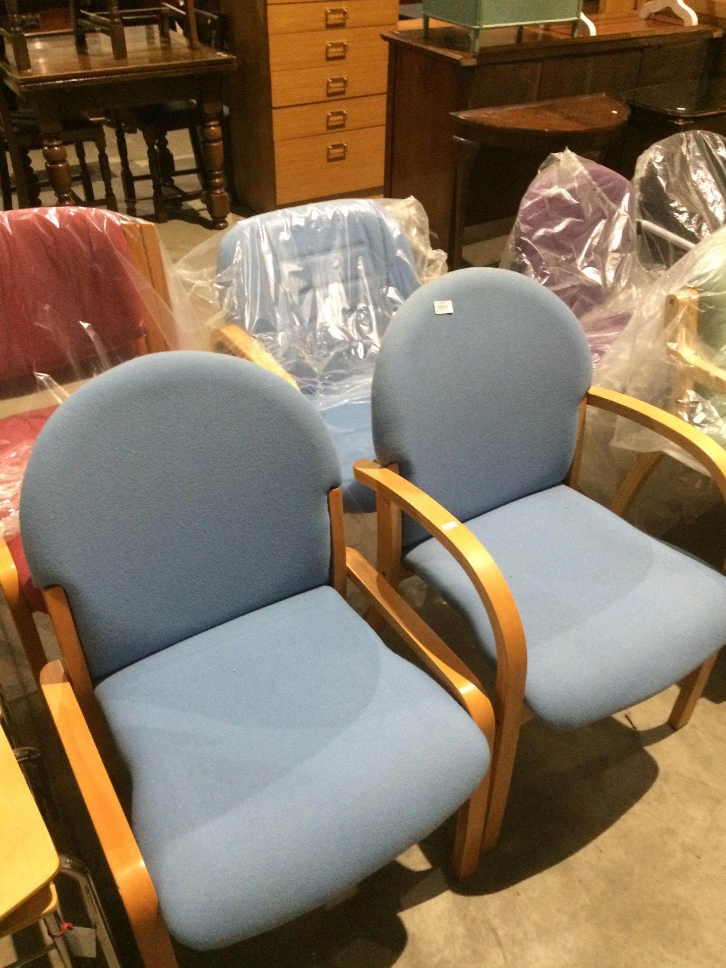 3 x assorted sky blue upholstered reception chairs on light wood frames