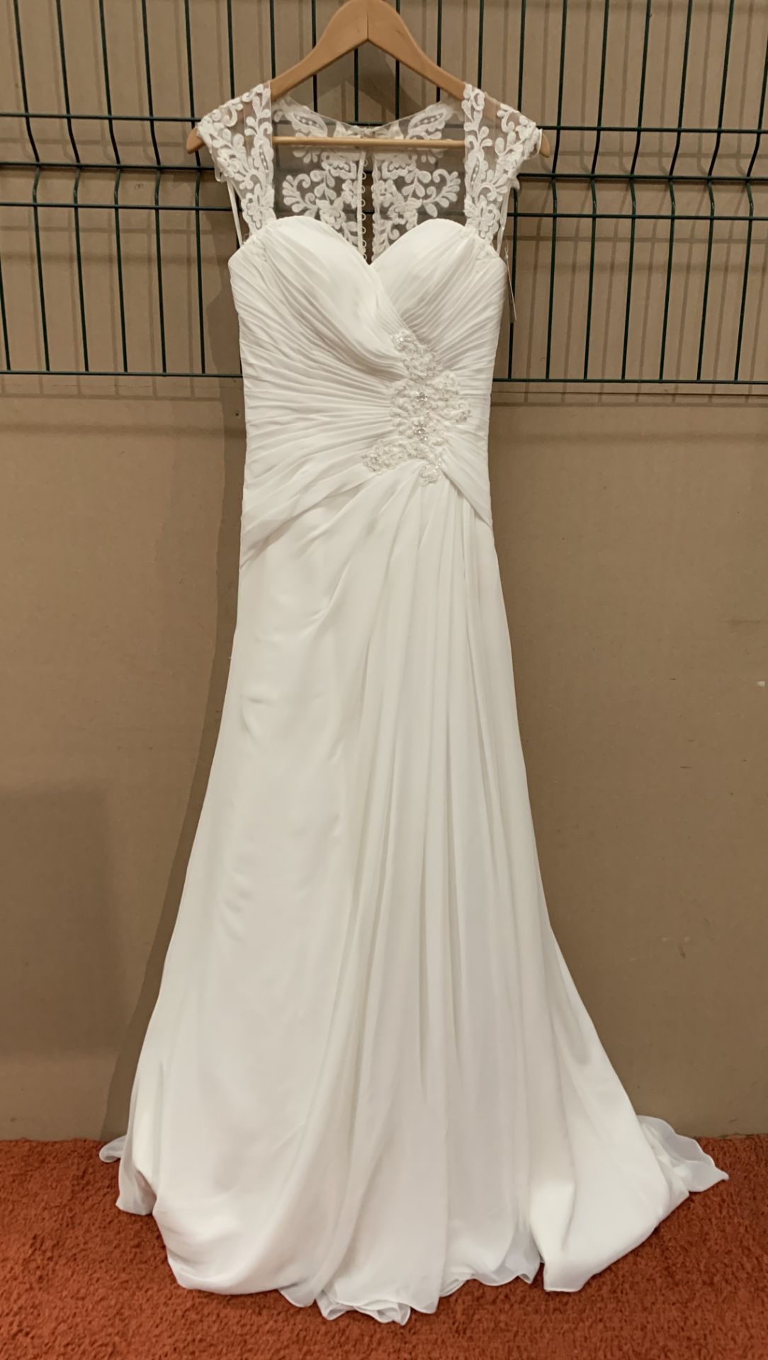 A wedding dress by Romantica, Milan Collection, model WW323, ivory, size 8,