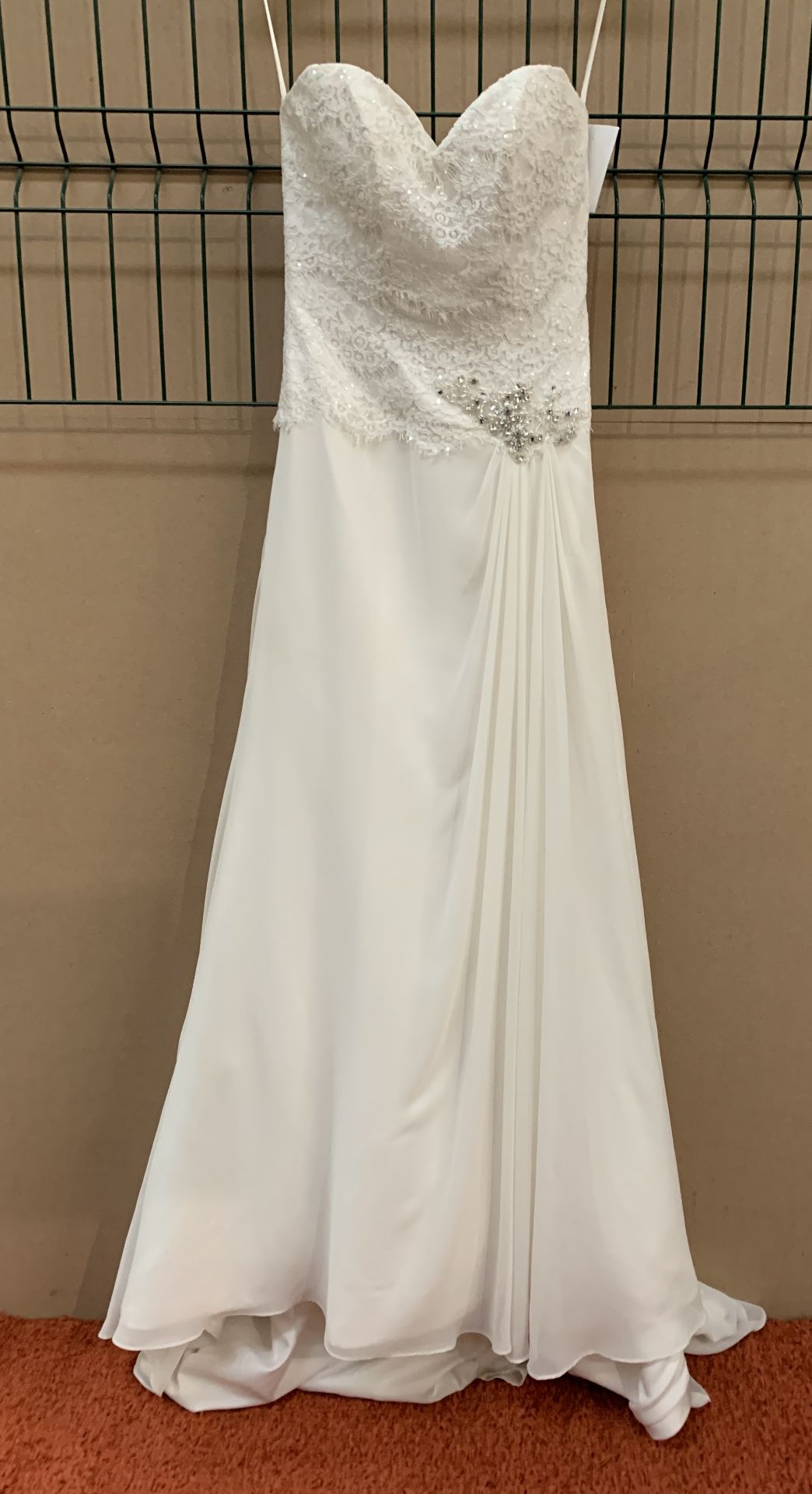 A wedding dress by Romantica Collection, ivory, size 10,