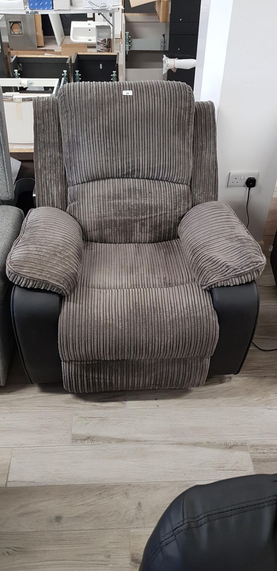 Grey cord side operated electric recliner chair