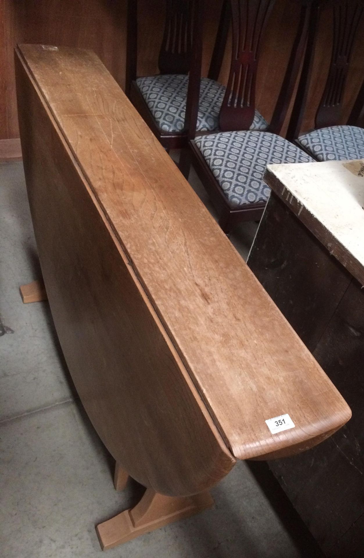 An Ercol style light elm drop leaf dining table 126 x 140cm extended