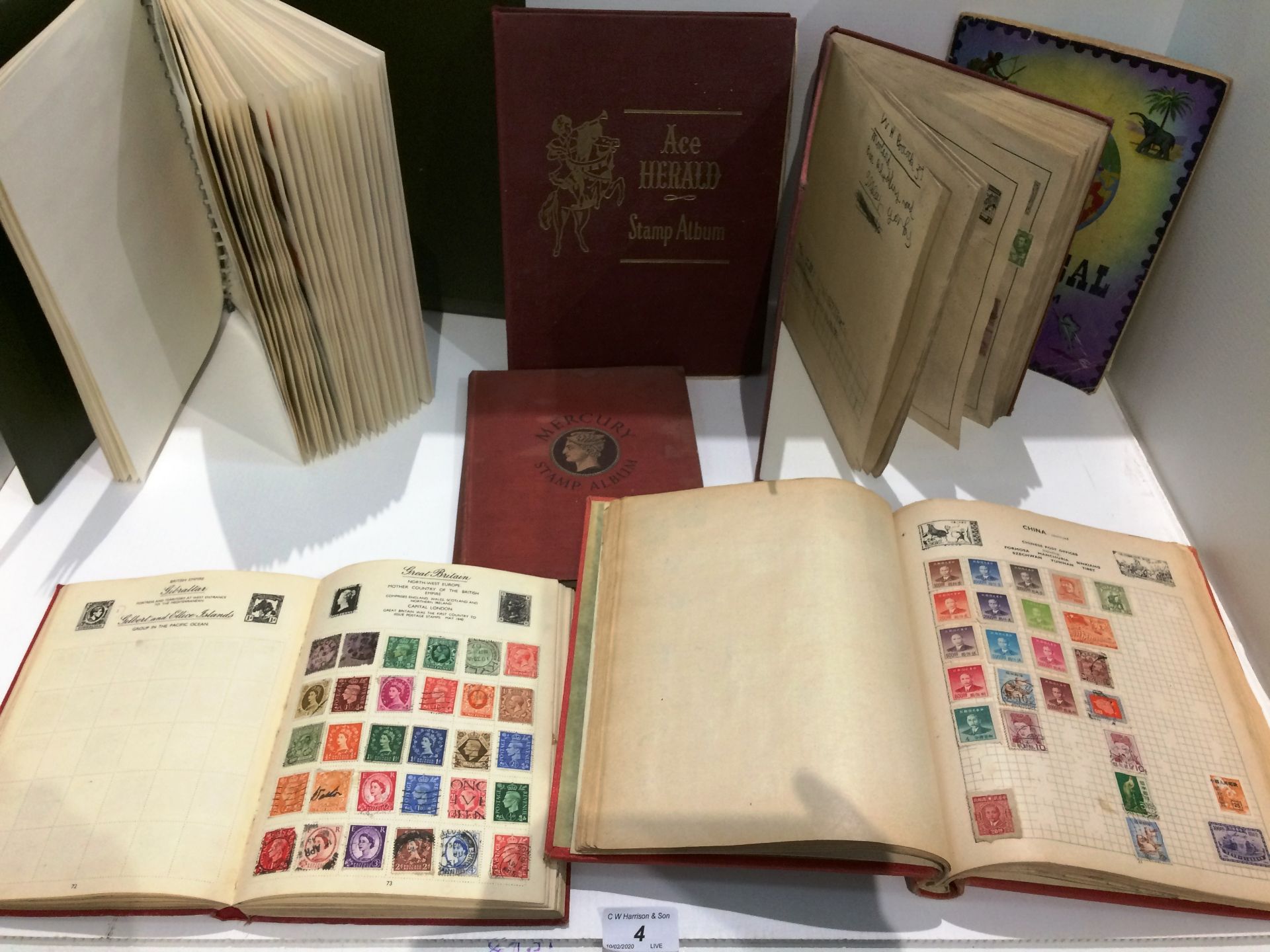 Seven stamp albums containing world stamps circa 1970s/80s