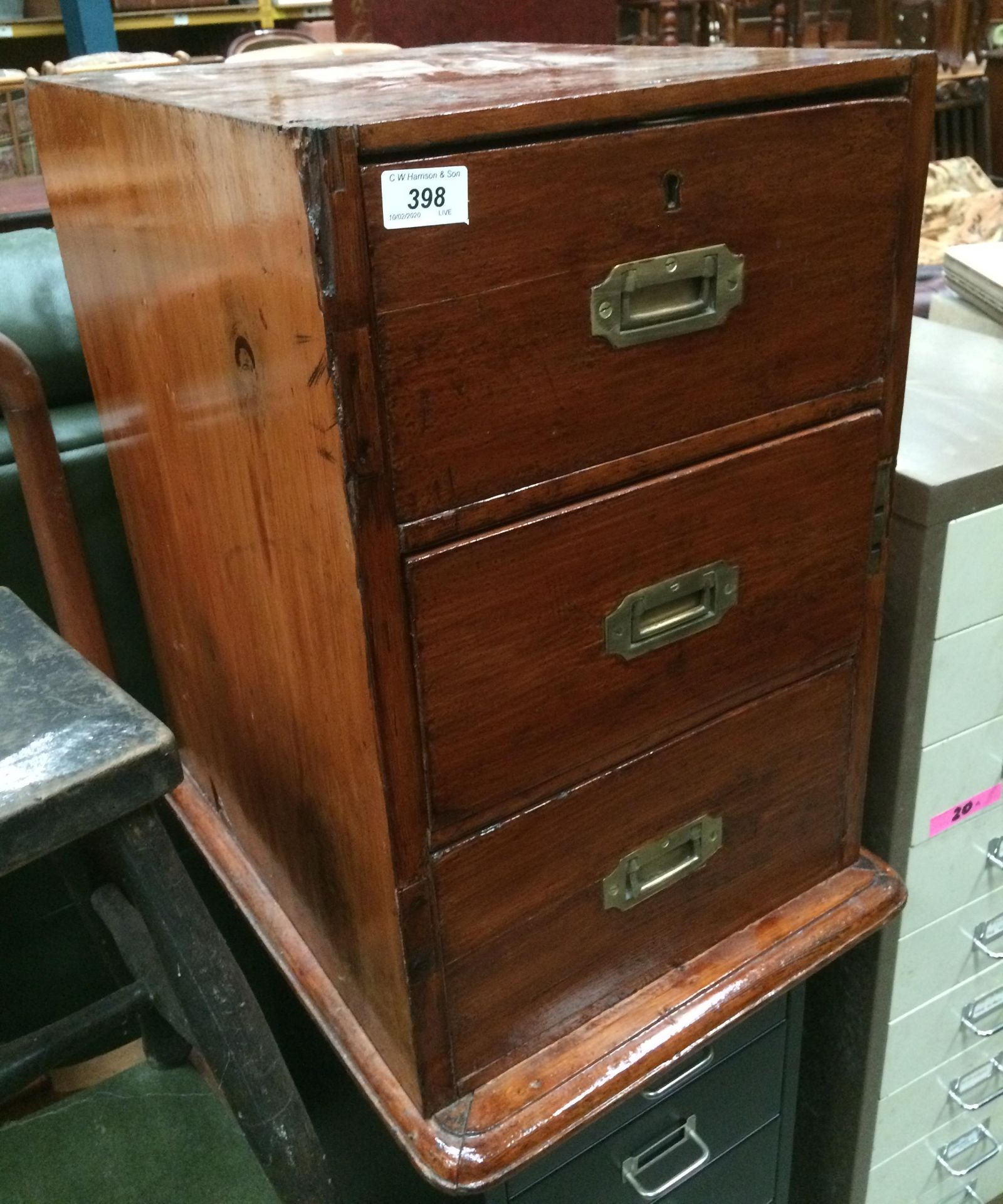 A stained pine three drawer ex desk pedestal