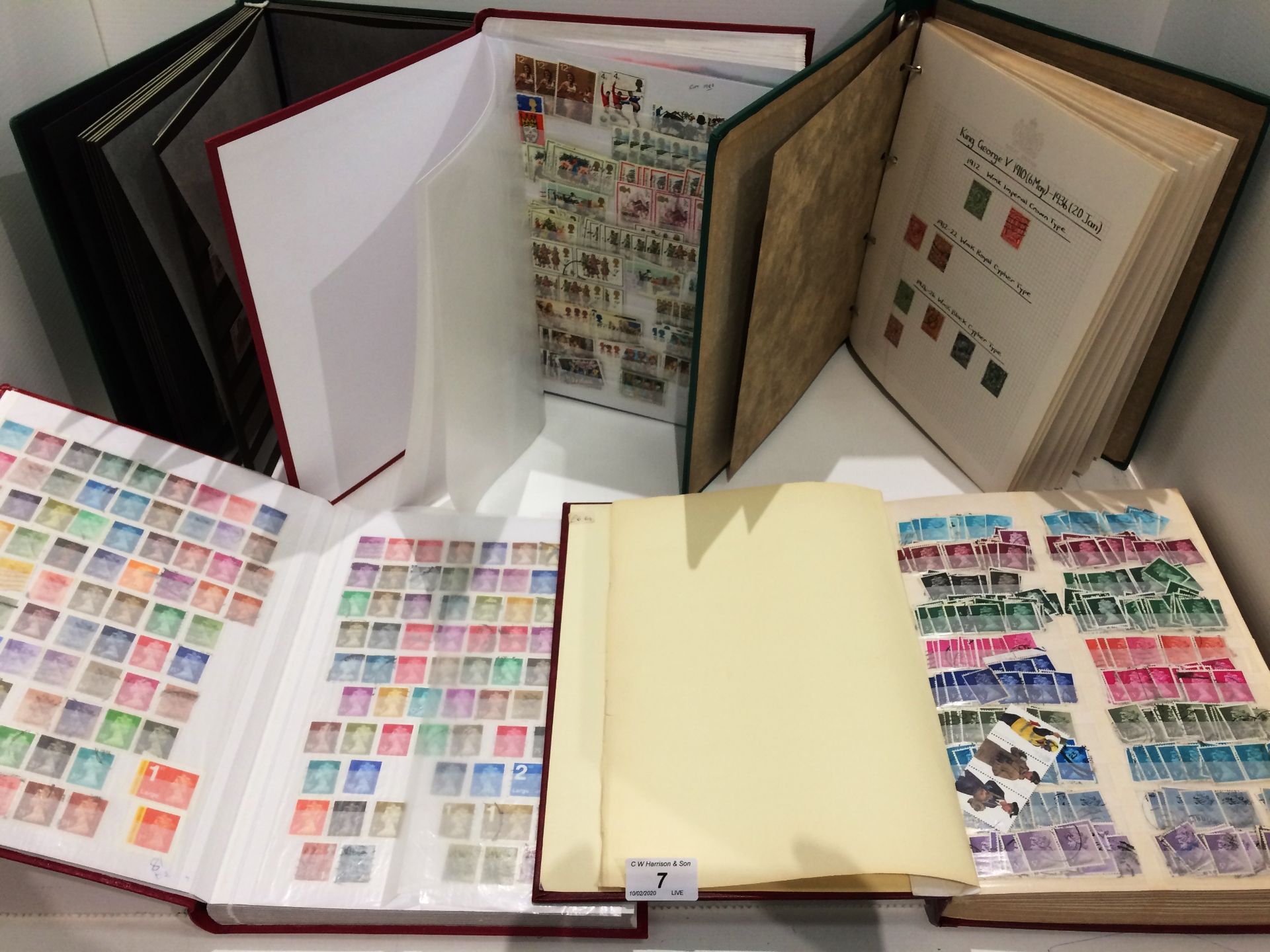 A GB stamp album containing stamps from the 1930s-1980s and four other stamp albums circa 1960/80s