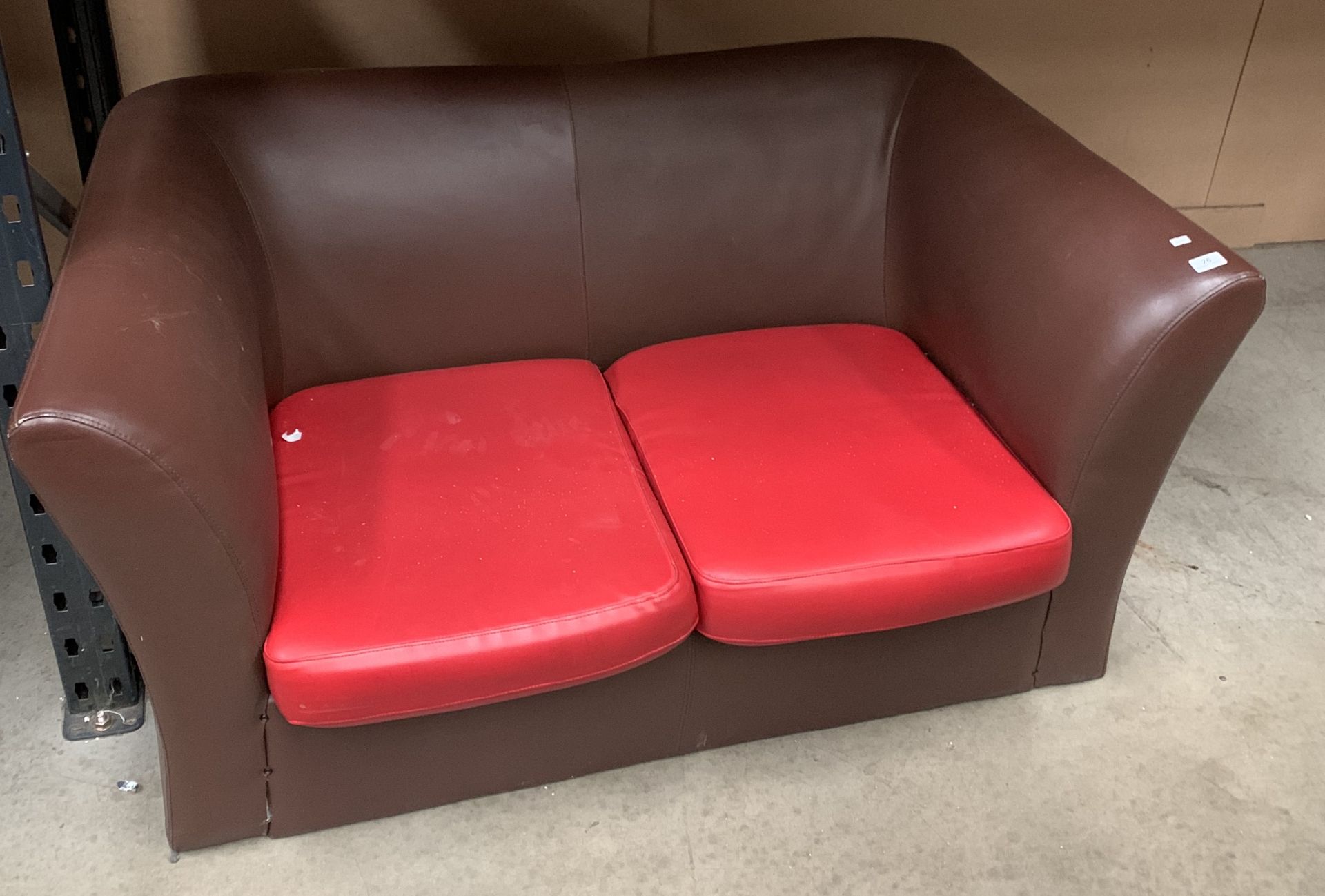 Brown and red vinyl upholstered two seat