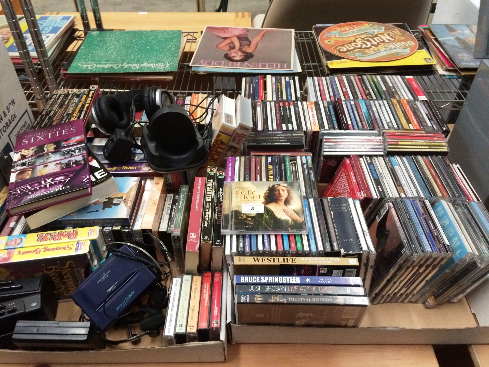 Contents to four trays a selection of Talking Book cassette tapes, VHS videos, CD's and a few DVD's,