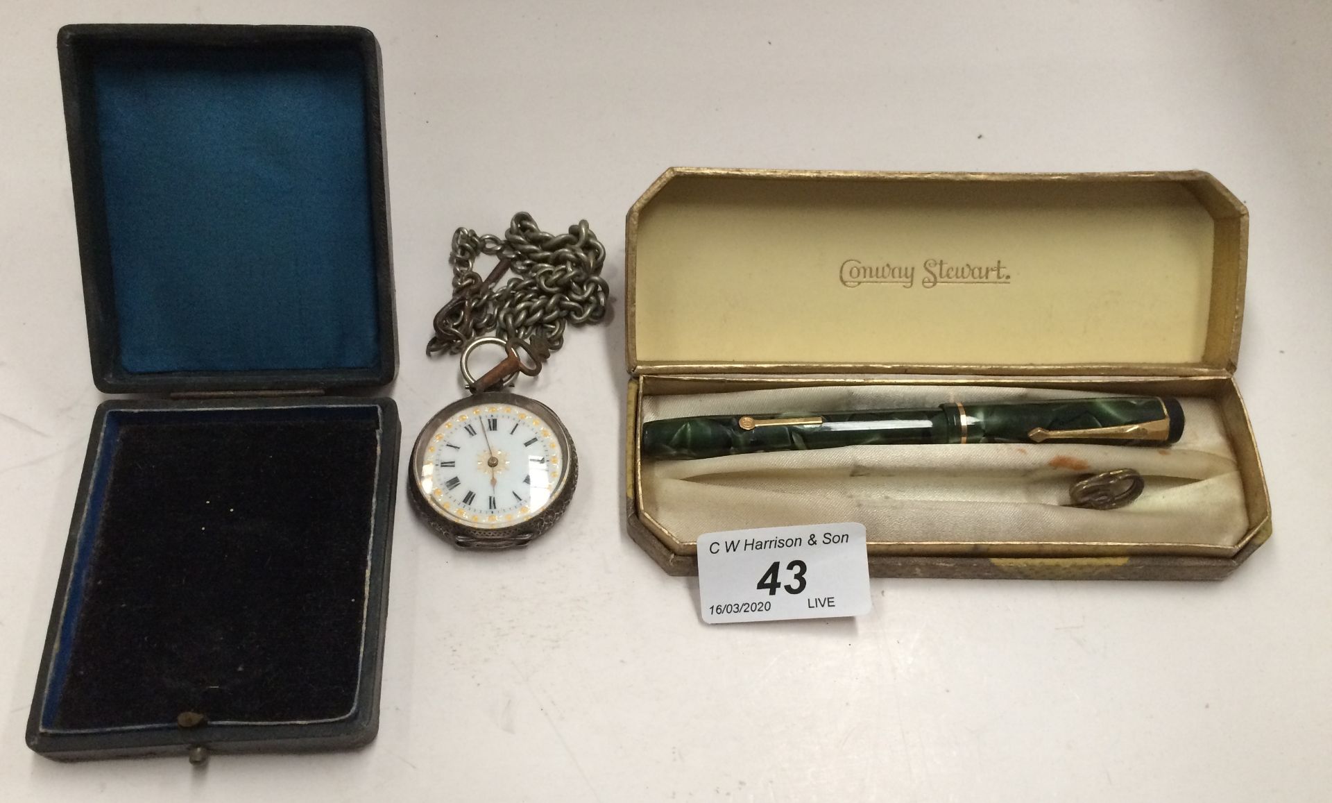 An engraved silver cased pocket watch with chain and a Conway Stewart fountain pen in case