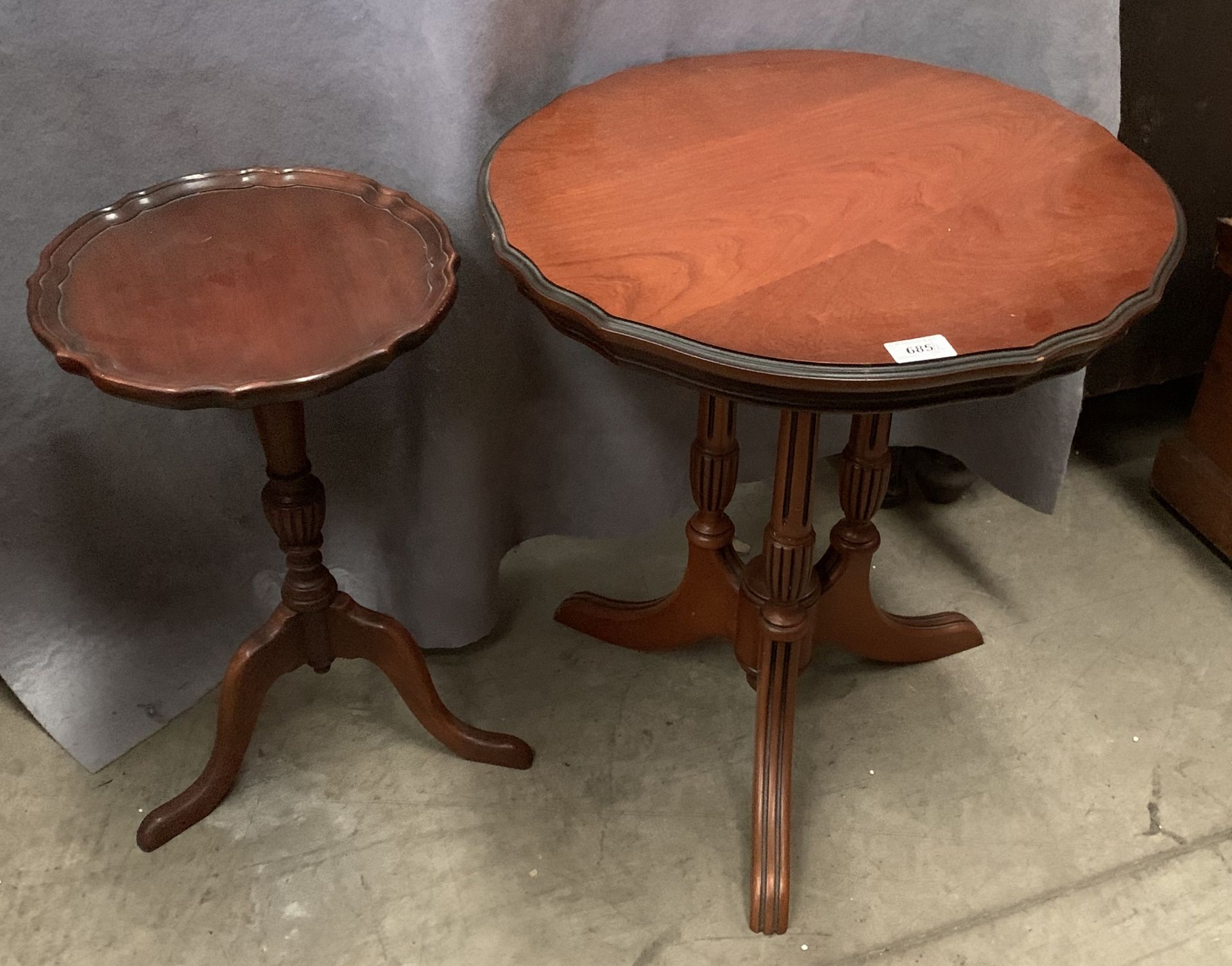 A small reproduction tripod side table and a reproduction tripod wine table (2)