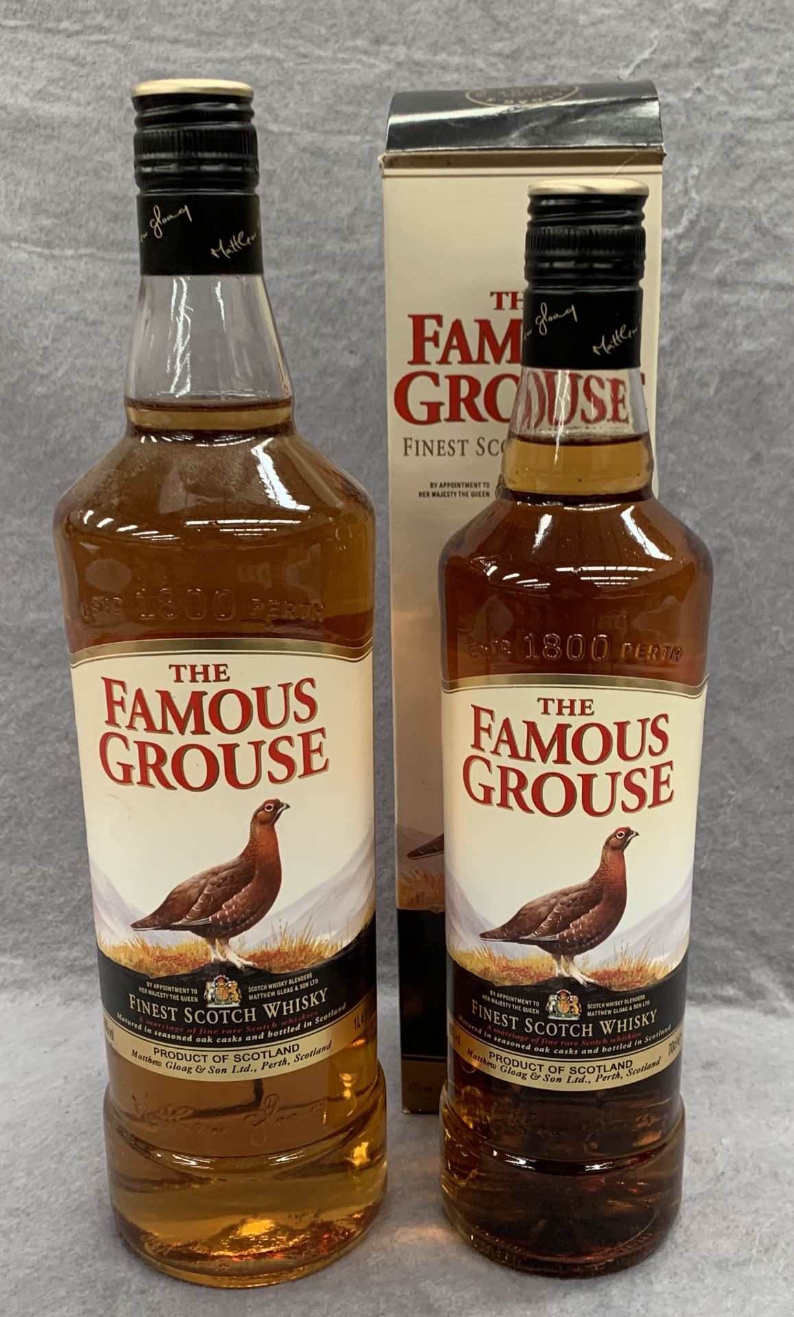 A 1 litre bottle of Famous Grouse Finest Scotch Whisky and a 75cl bottle of Famous Grouse Finest
