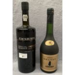 A 1 litre bottle of Cockburns Special Reserve Port and a 70cl bottle of Sandeman Imperial Brandy