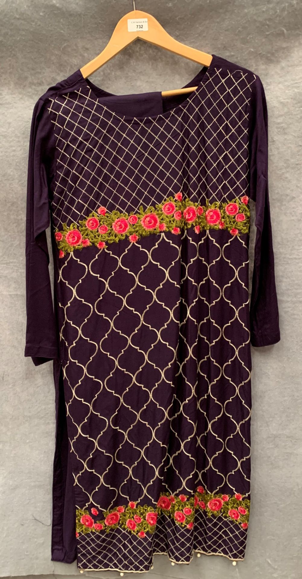 A three piece outfit in purple pattern,