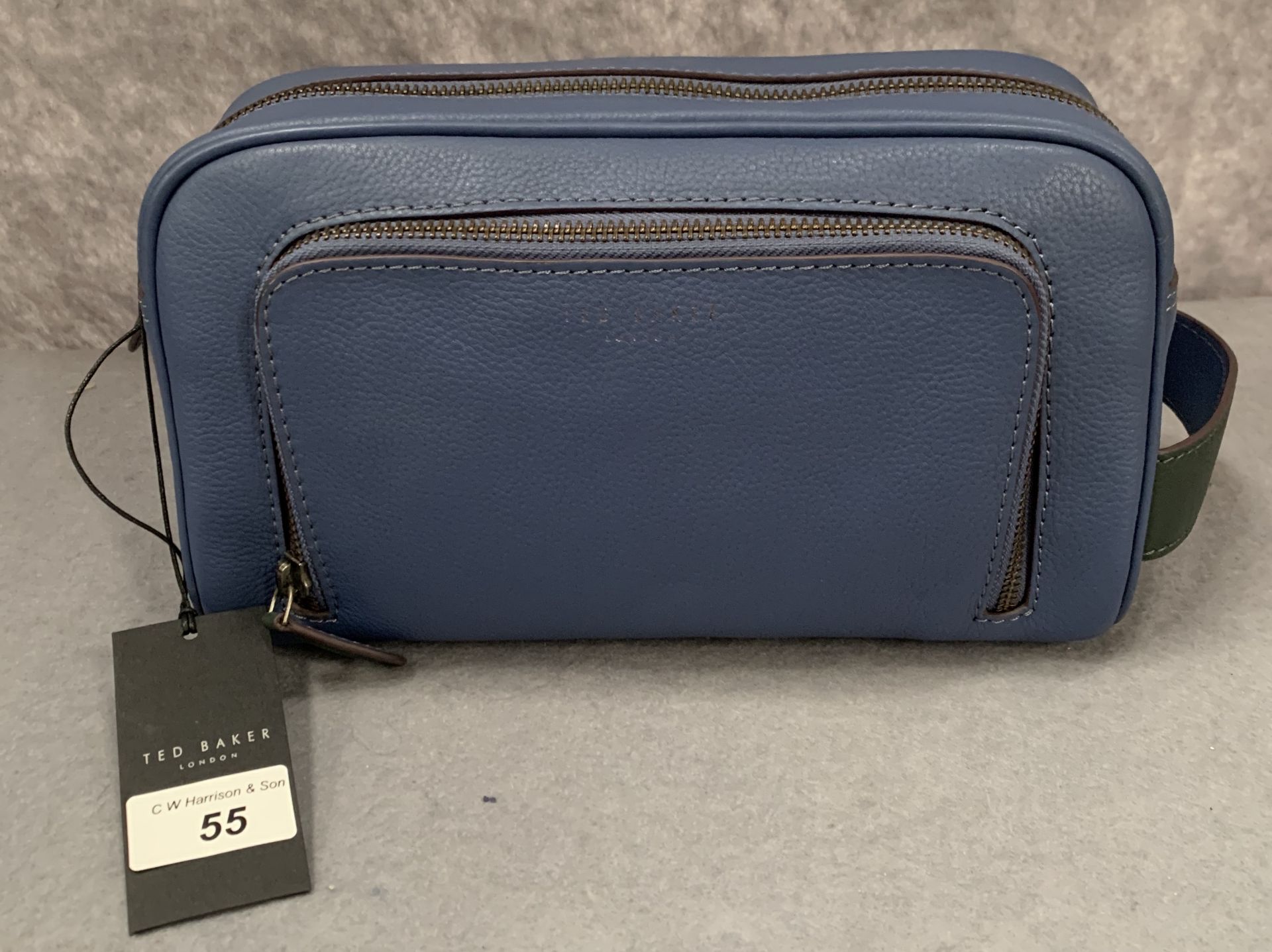 A Ted Baker London mid blue coloured leather wash bag,