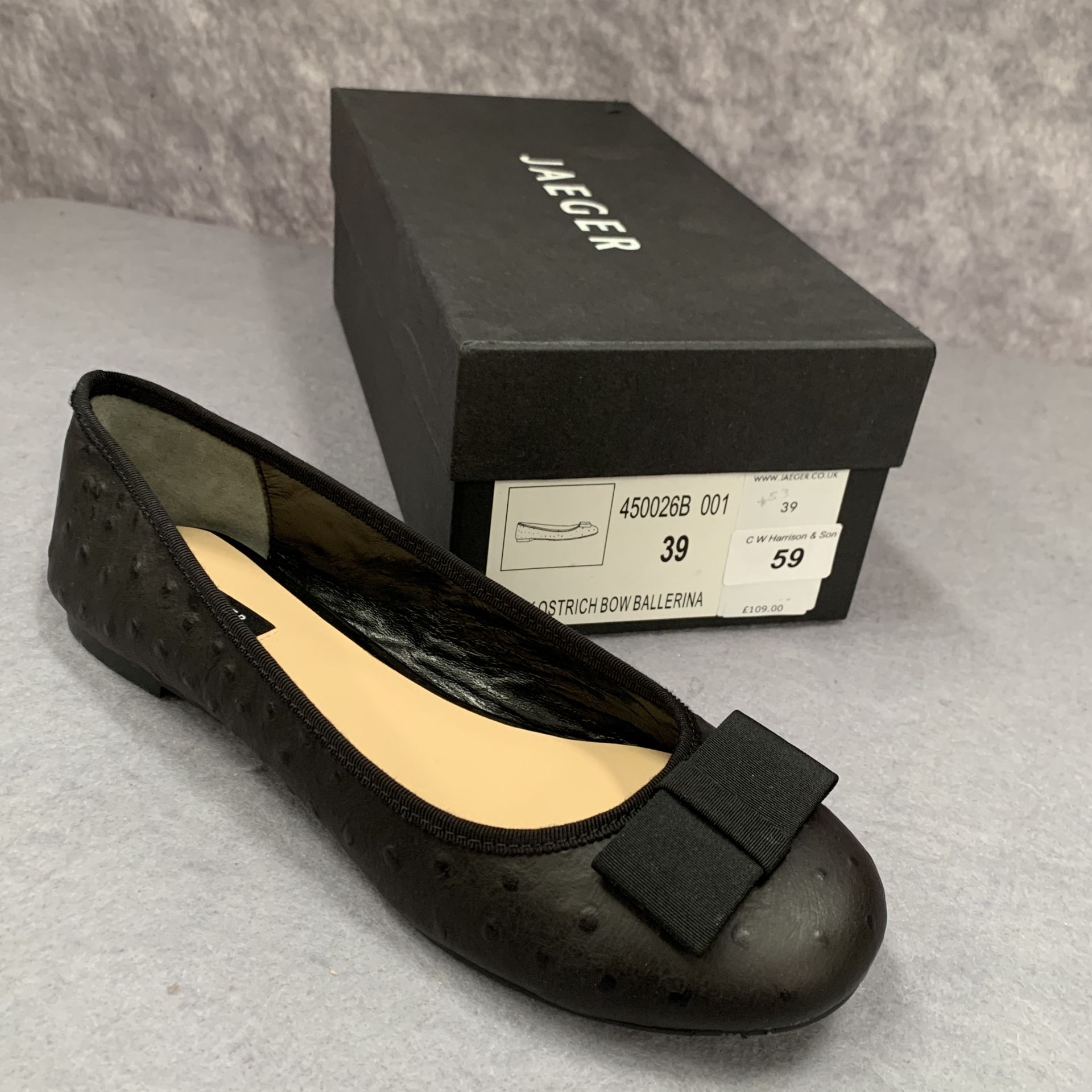 A pair of Jaeger black ostrich bow ballerina shoes, size 39,