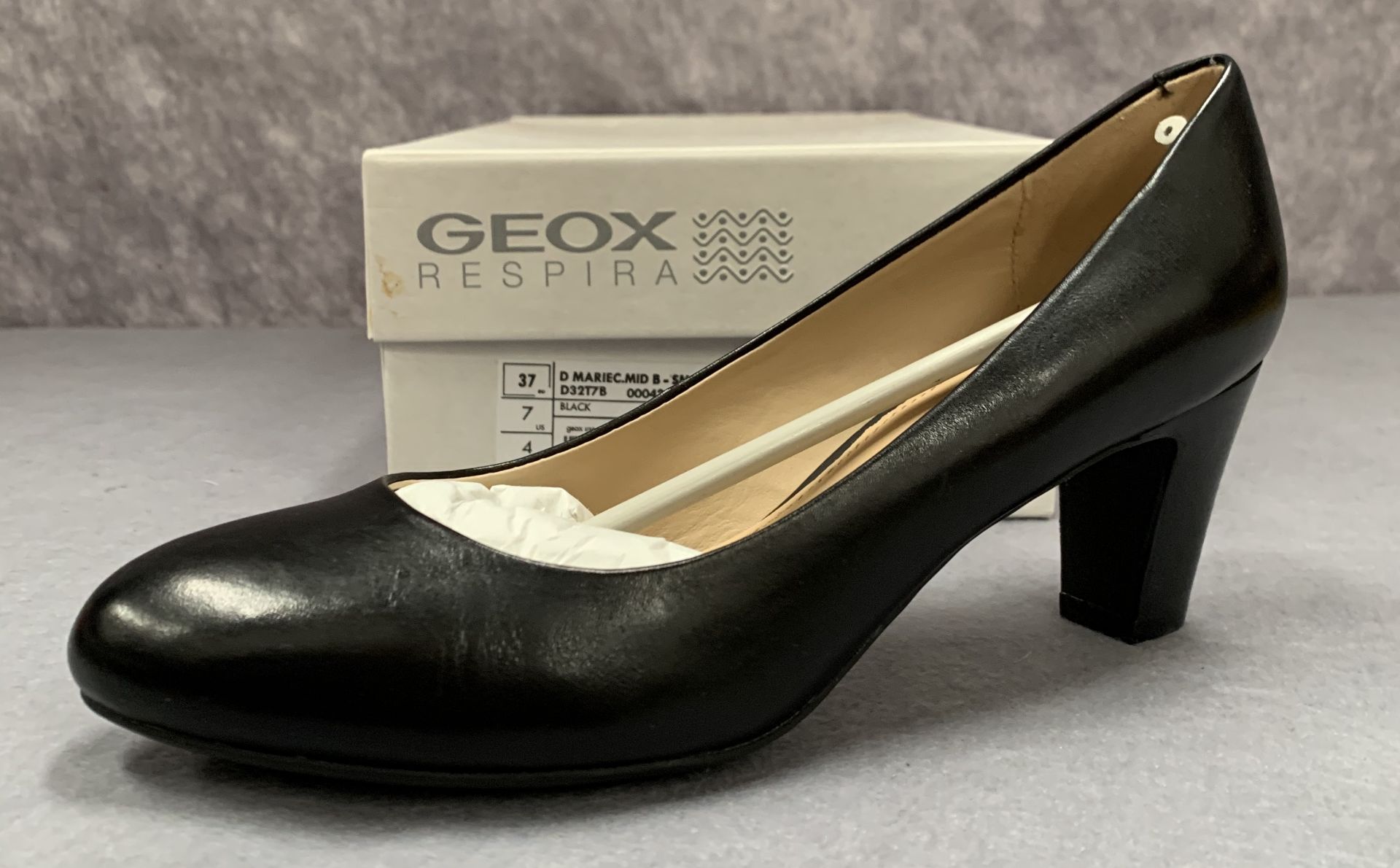 A pair of Geox Respira ladies black smooth leather court shoes, size 7,