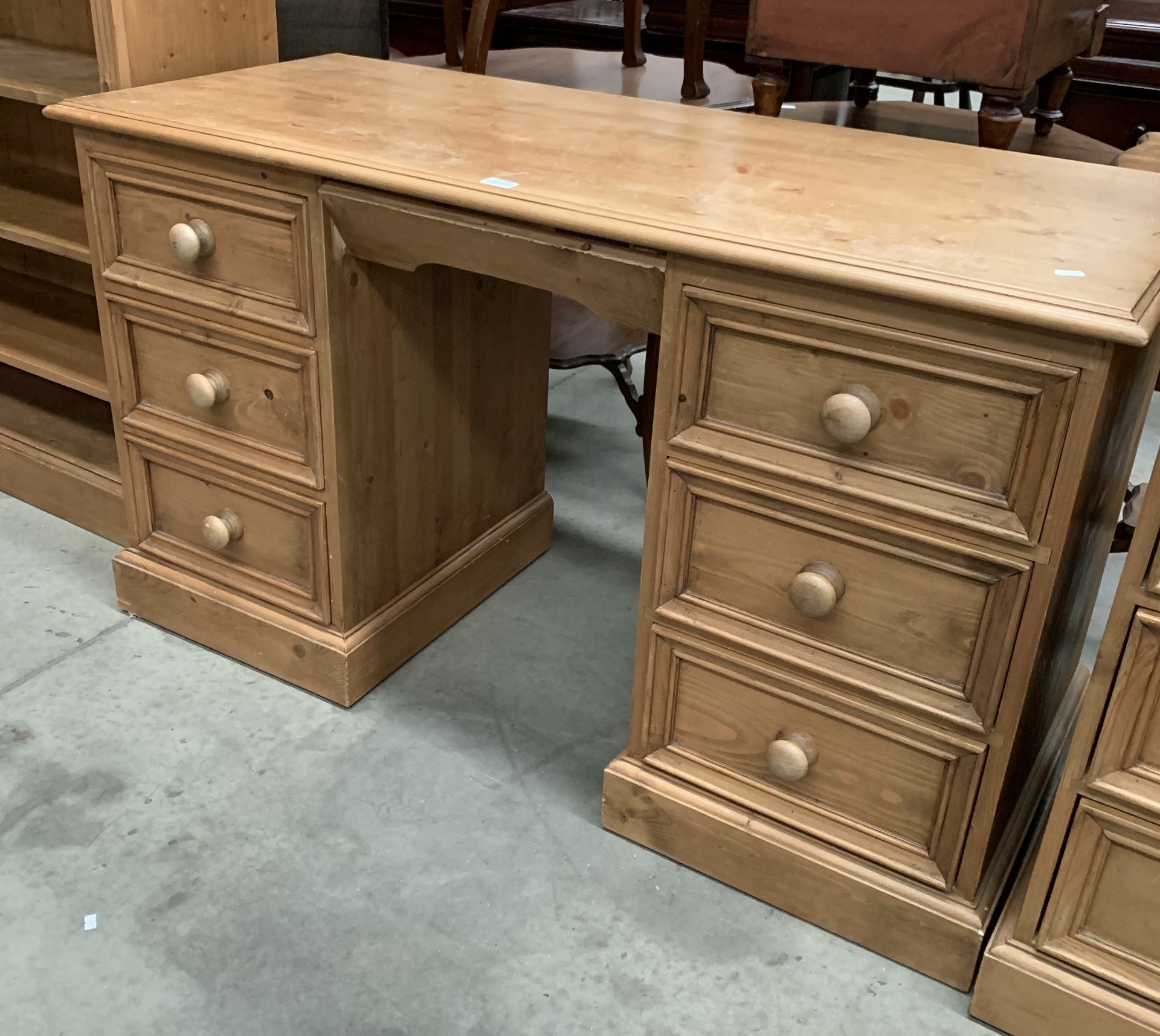 A pine six drawer twin pedestal desk/dressing table,