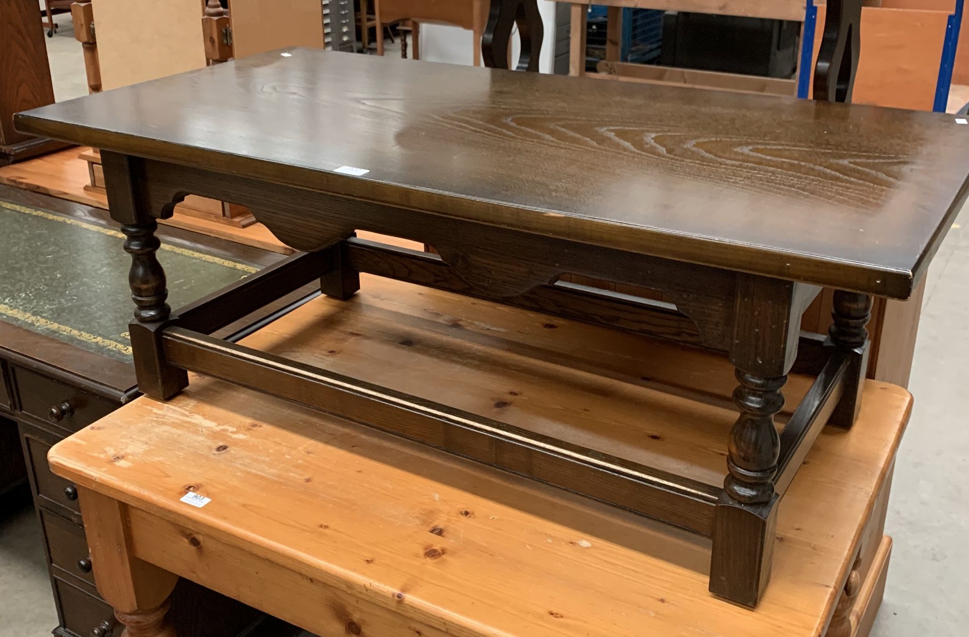 A dark oak finish coffee table