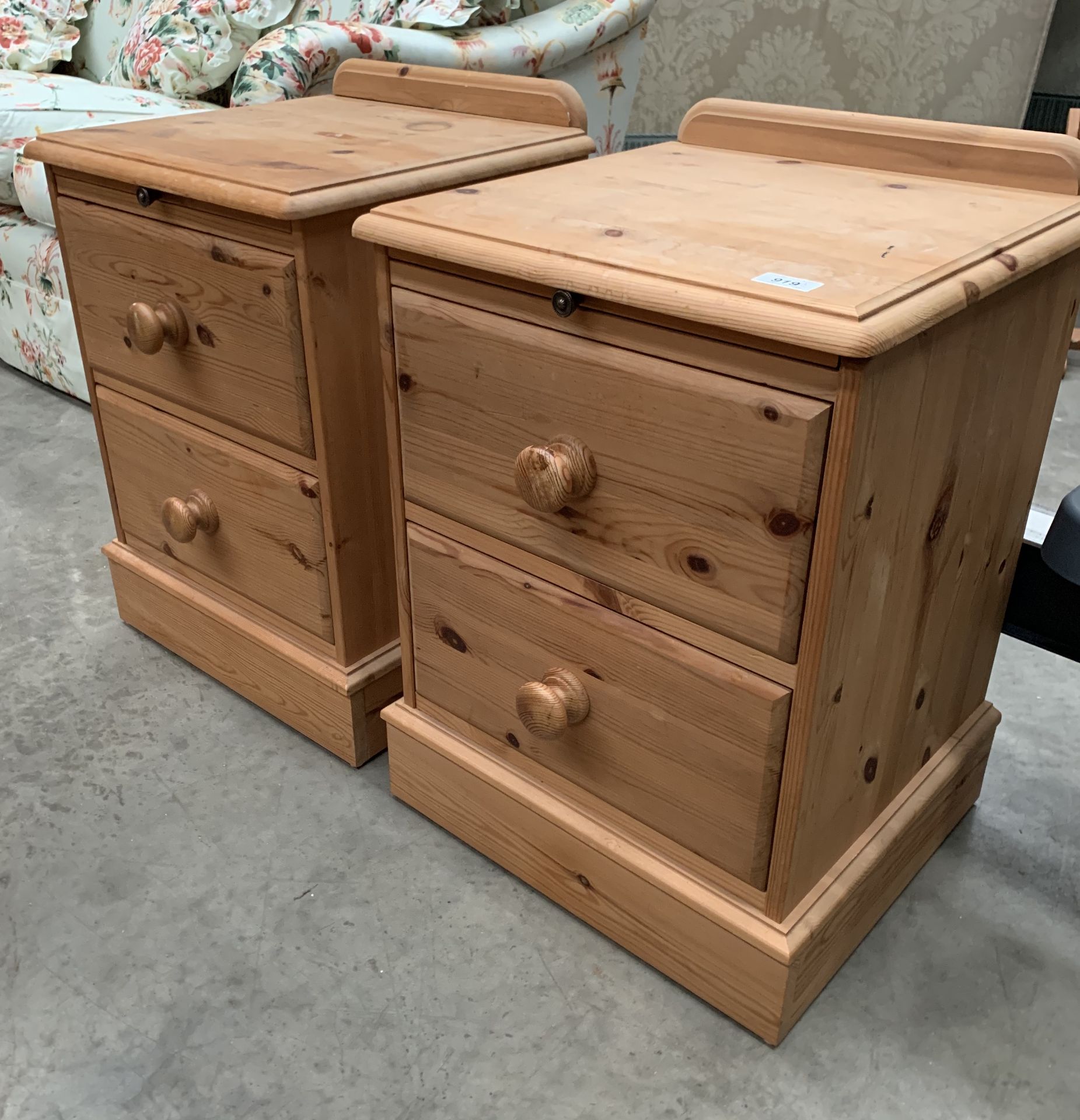 A pair of pine two drawer bedside pedestals