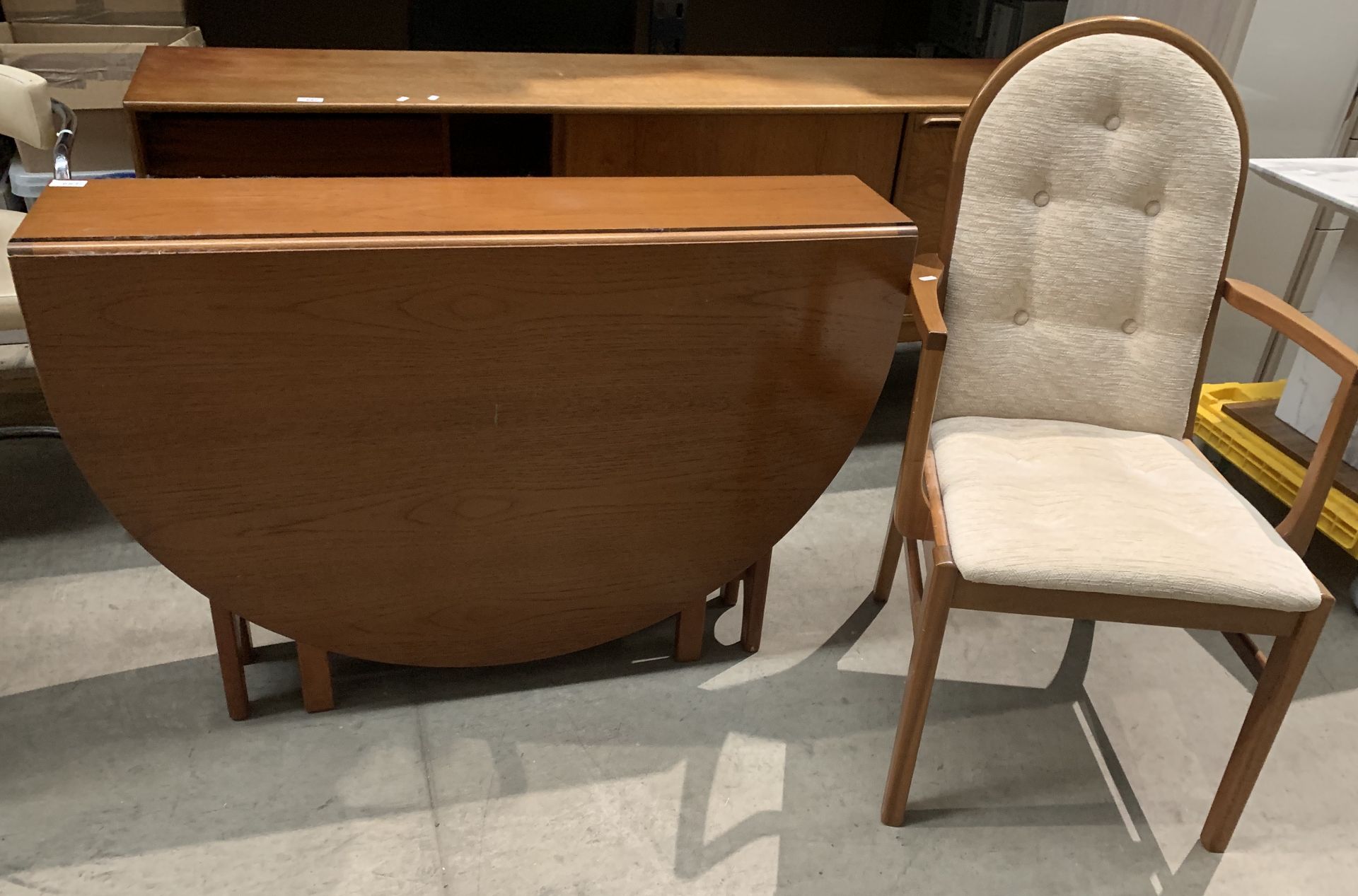 A teak gateleg oval dining table,