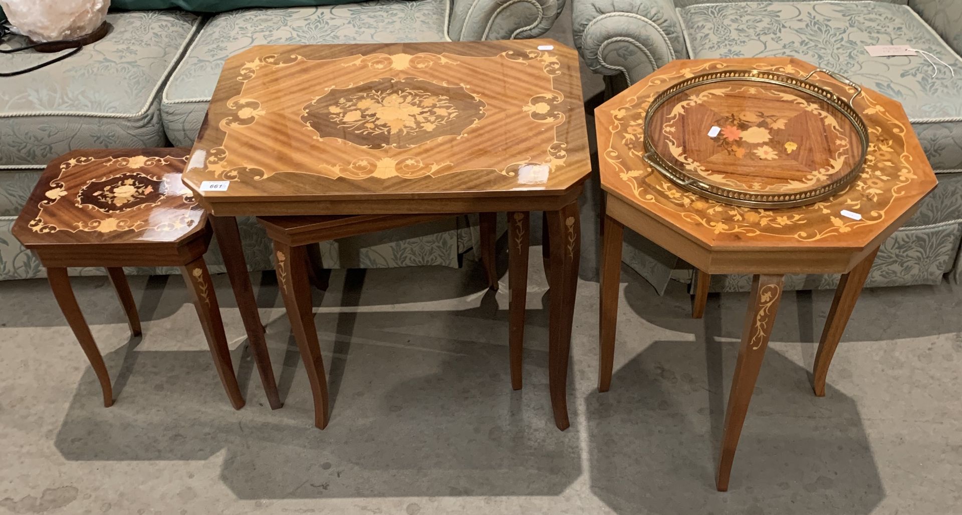 A reproduction Italian style nest of three coffee tables with inlay decoration (the smaller one is