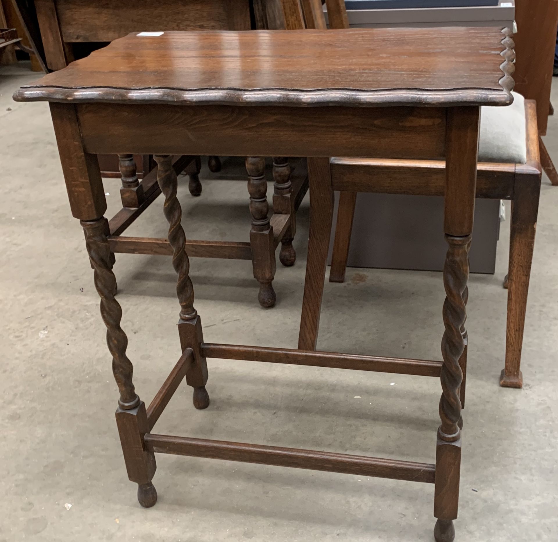 An oak side table with barley twist legs