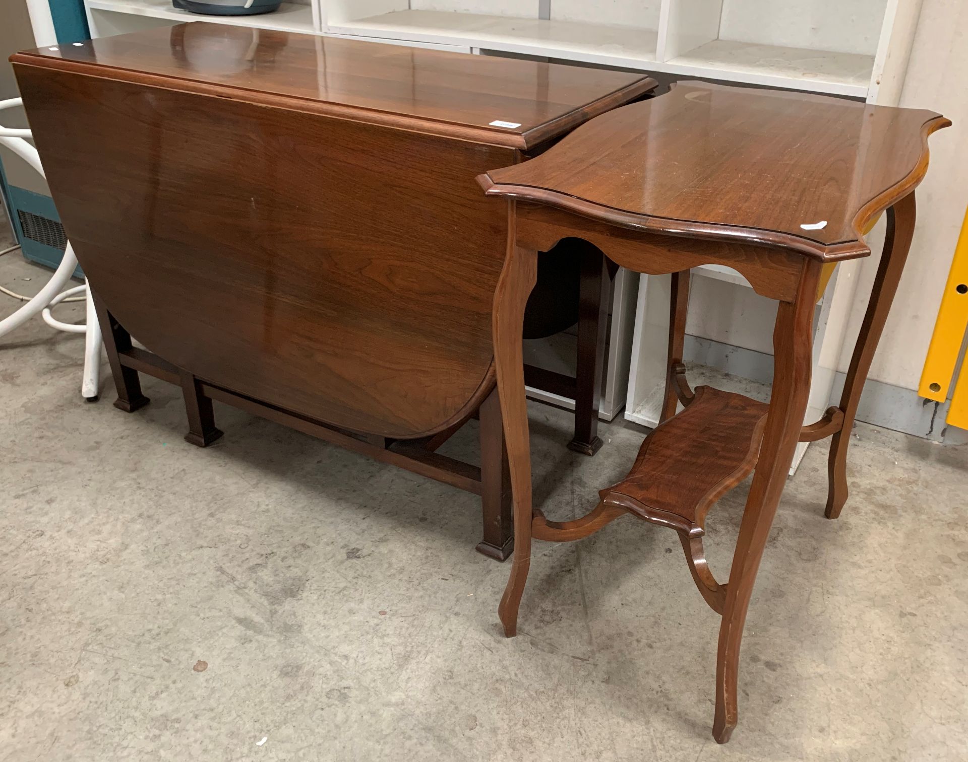 A mahogany oval drop leaf dining table,