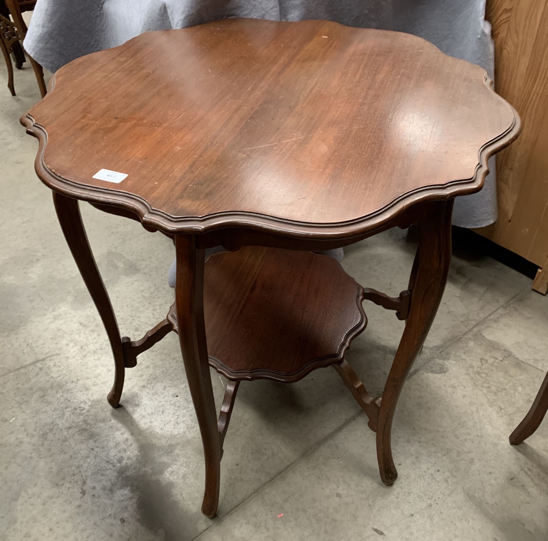 A mahogany circular window table with undertray,