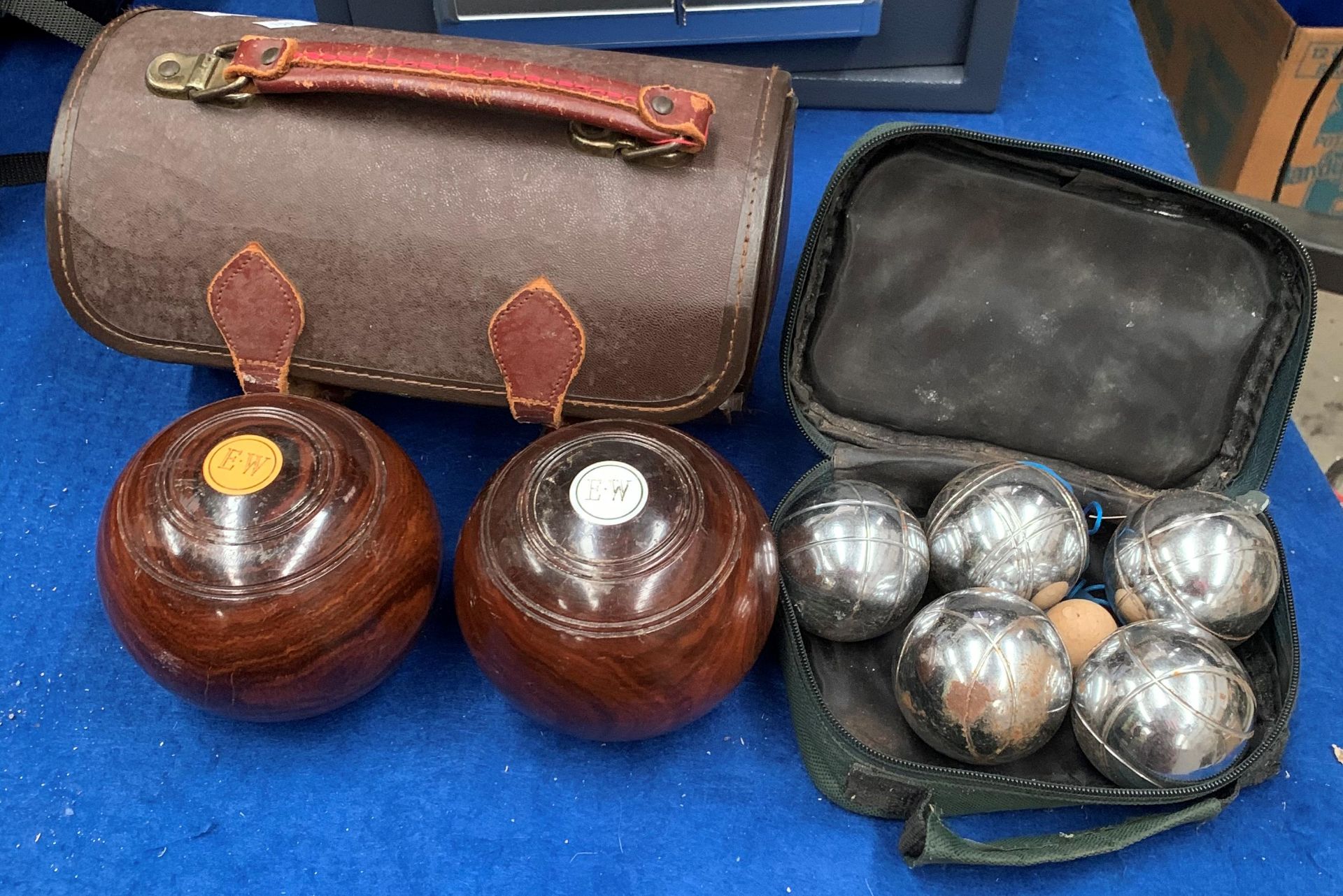 Two bowls and a bag and a small set of modern boules in a bag (3)