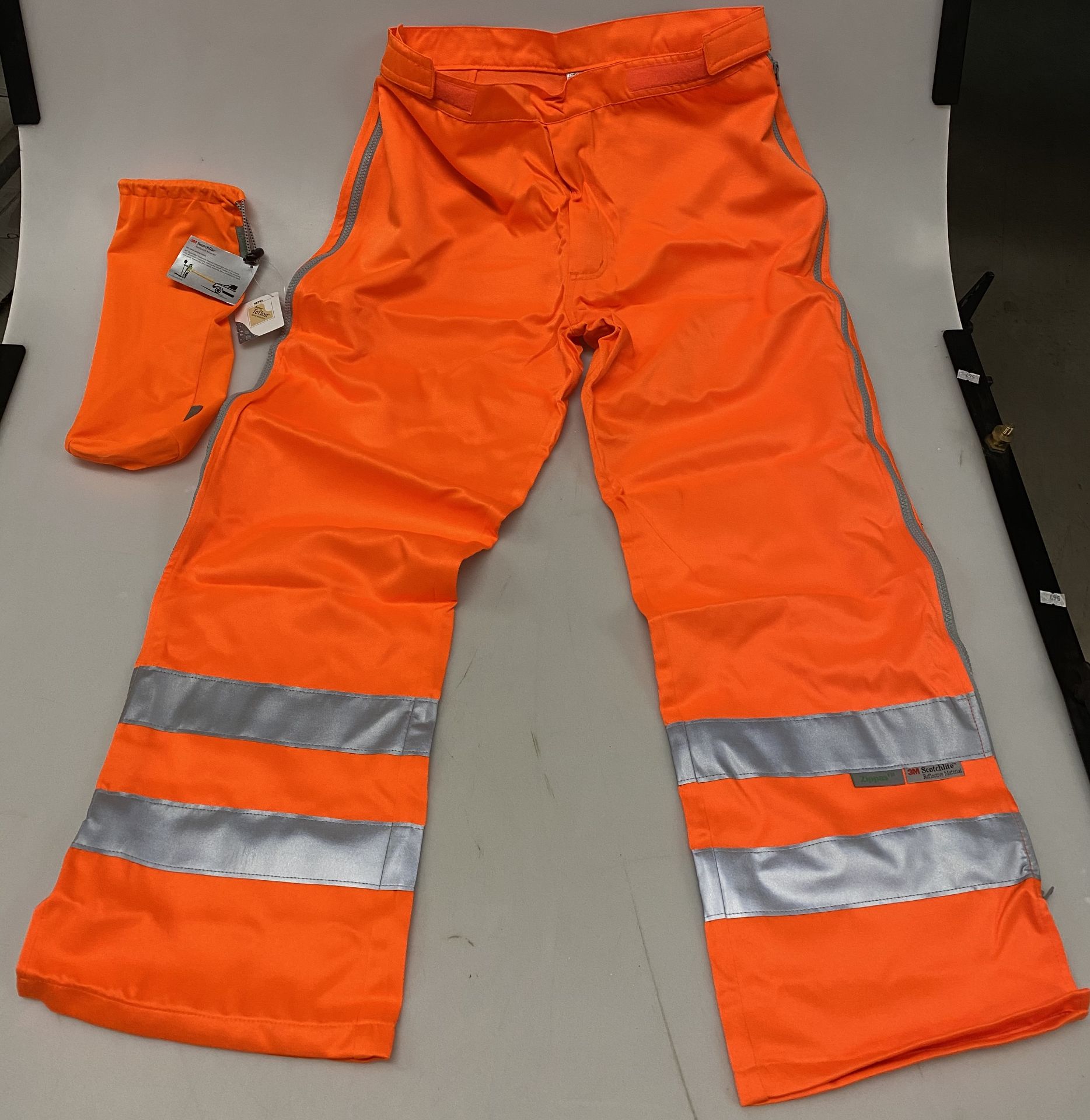 16 x Hi-Vi Zippas MX orange PPE high visibility Teflon/Scotchlite zipped over trousers and bags.
