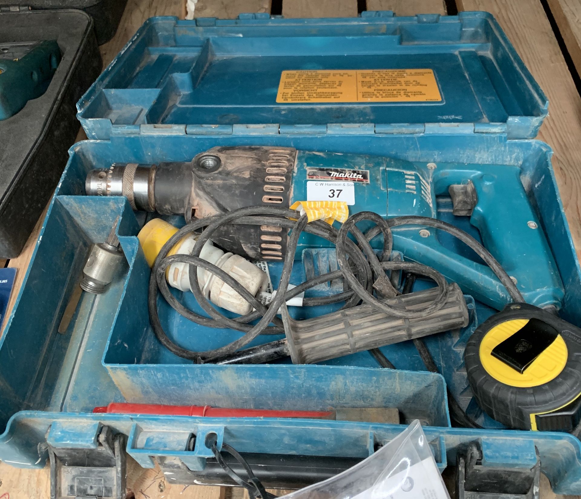 A Makita 8406 110v hammer drill in carry case