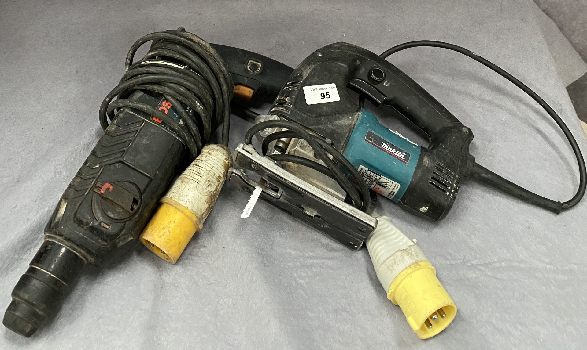 A Bosch 110v electric drill and a Makita 110v jigsaw