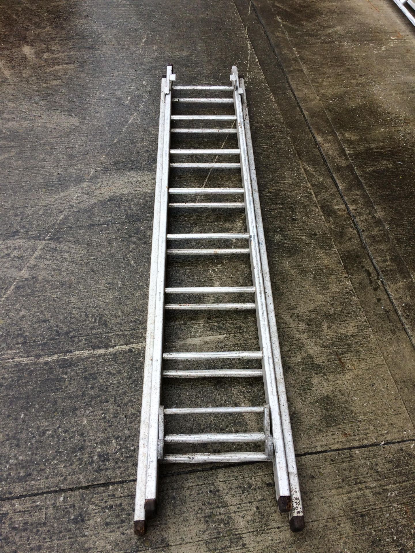 A small 16 rung double extension ladder - aluminium