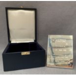 A Sterling Silver presentation plaque dated 2006 in presentation box overall weight including wood