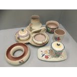 Nine pieces of floral patterned Poole pottery - bases, bowls, dishes etc.